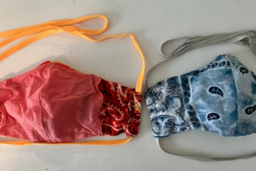 Front and back of surgical masks, on the left you can see the additional slit that filter paper can be inserted into